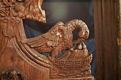 Bench end, bird with chicks  © Leicestershire County Council